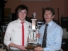 Leo Heatley presents Under 16 Football captain Daniel Mc Erlaine with the Pat Henderie Trophy